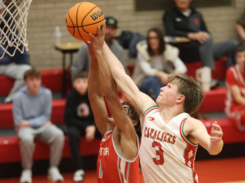 L-P's Braylin Bond looks to grab a rebound away from Streator's Layzeric Moton during the Dean Riley Shootin' The Rock Thanksgiving Tournament on Monday Nov. 24, 2025 in Kingman Gymnasium at Ottawa High School.