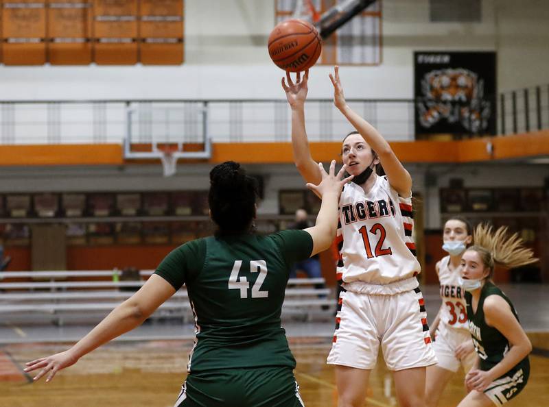 Crystal Lake Central's Paige Keller shoots the ball over Crystal Lake South's Nicole Molgado during a Fox Valley Conference game Wednesday, Jan. 26, 2022, between Crystal Lake South and Crystal Lake Central at Crystal Lake Central High School.