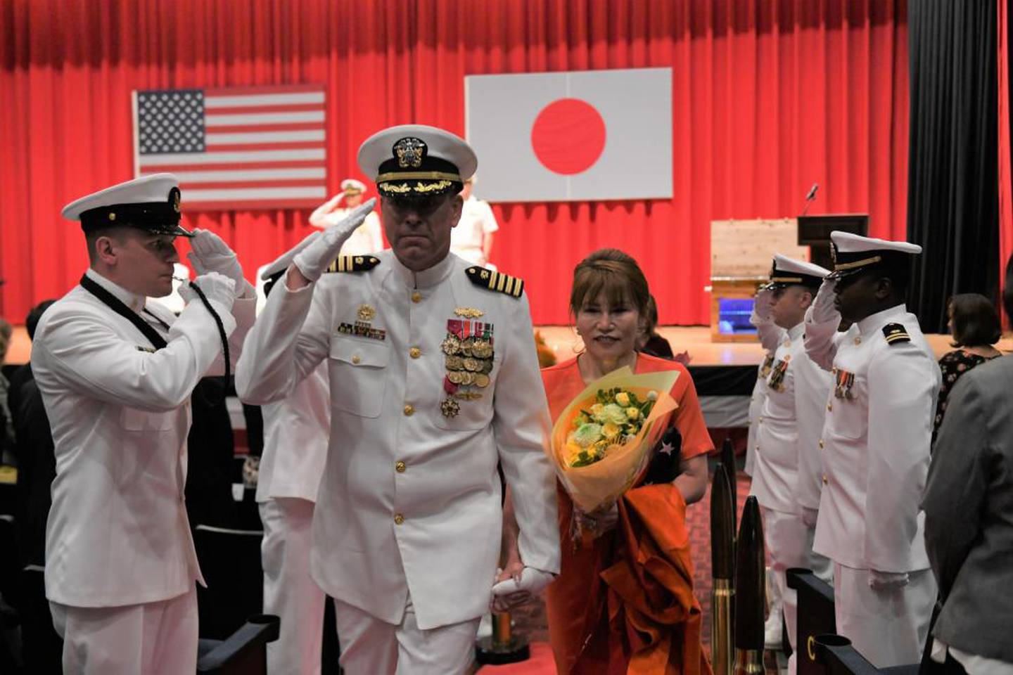 Capt. Tim DeWitt, Naval Facilities Engineering Systems Command Fast East, is relieved by Capt. Lance Flood during a change of command and retirement ceremony for DeWitt on board Fleet Activities Yokosuka, Japan, Oct. 28.