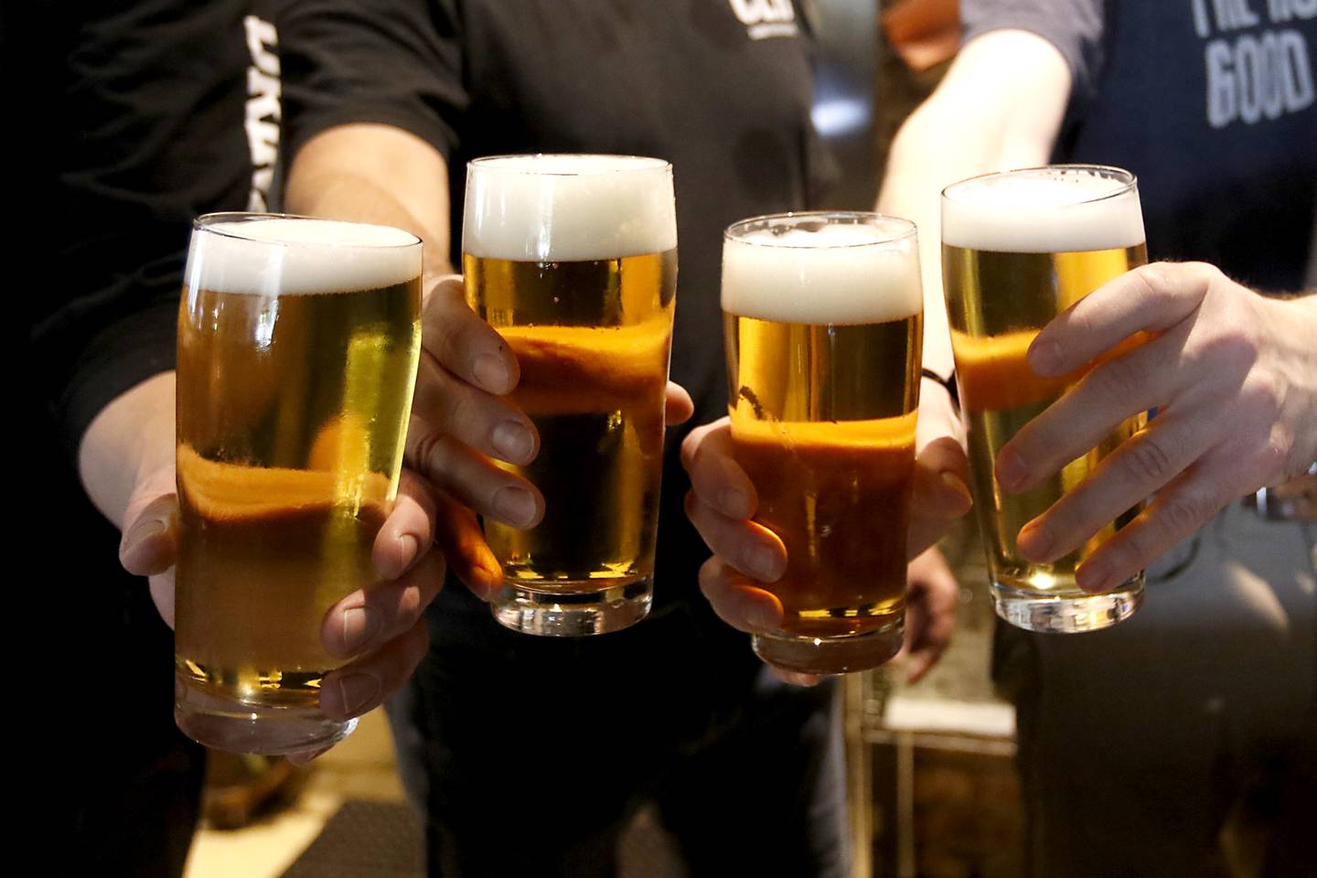 The brewing staff at Crystal Lake Brewing,  Pete Mangan, Brewmaster Ryan Clooney, Ryan Anderson and Ryan Wayghon cheers their beers at the Crystal Lake Brewing on Friday, May 3, 2024. The brewery is celebrating its 10th anniversary and recently won a bronze award in Brown Porter category at the World Beer Cup in Las Vegas.