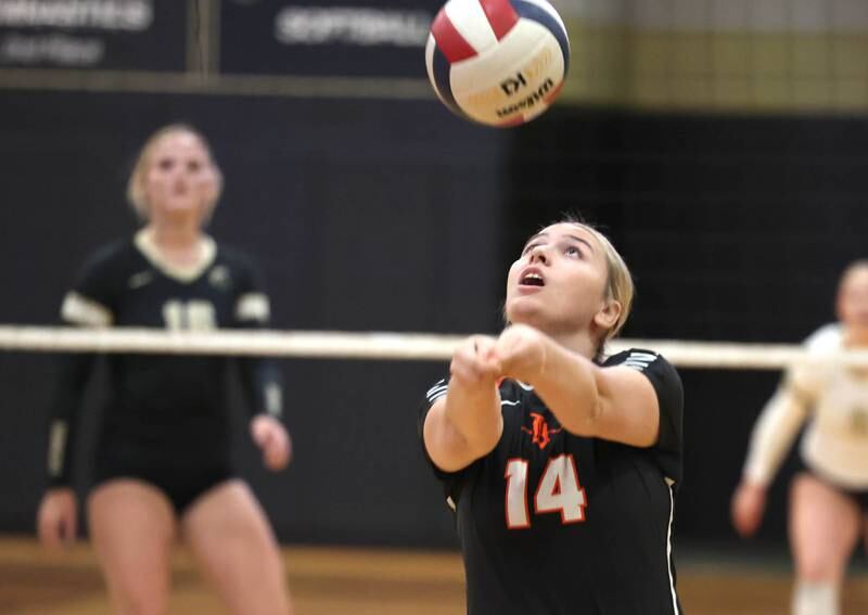 DeKalb’s Brooklynn Siebrasse bumps the ball during their match against Sycamore Monday, Oct. 16, 2023, at Sycamore High School.