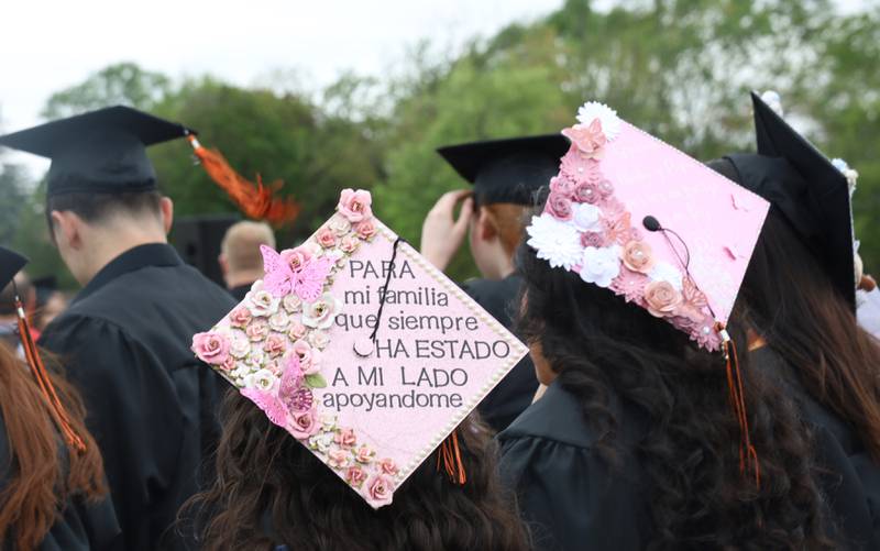 Decorated caps as members of the Class of 2025 graduate from McHenry High School during their commencement ceremony on Saturday, May 17, 2025, at McCracken Field in McHenry.