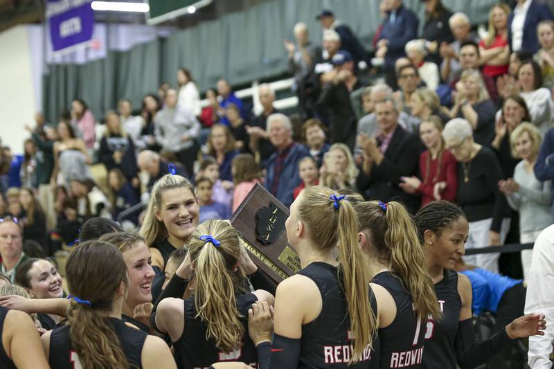 Benet celebrates their win over St Charles North in their Class 4A Glenbard West Sectional final volleyball match. Nov 6, 2025 in Glen Ellyn.