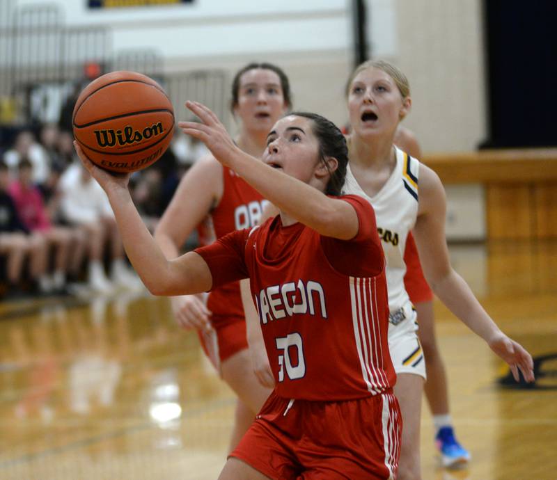 Oregon's Mya Engelkes (30) puts up a shot against Polo during Tuesday, Dec. 5, 2023 action at Polo High School.