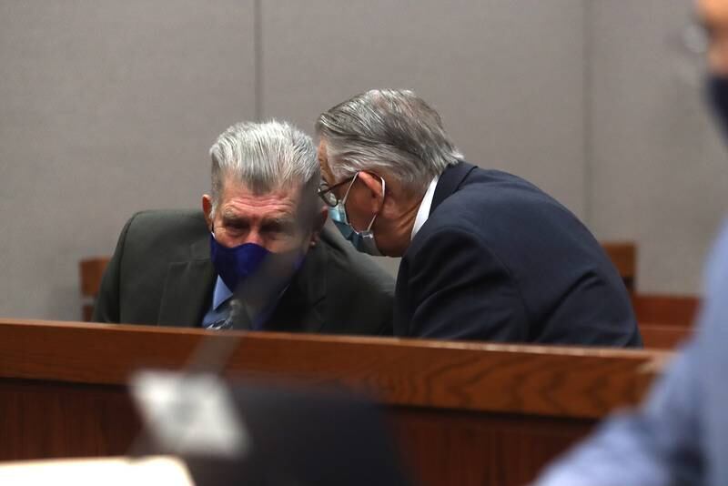 A conversation takes place during a hearing Thursday, Dec. 16, 2021, for defendants Colin Scott and Michael Penkava at the Michael J. Sullivan Judicial Center in Woodstock.