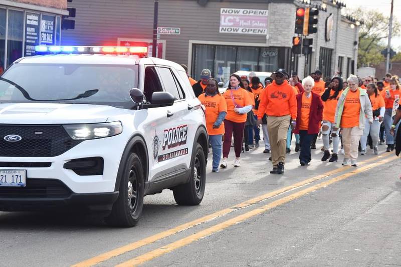 Participants travel through Kankakee during Kankakee Forgives' Walk Against Violence in 2024.