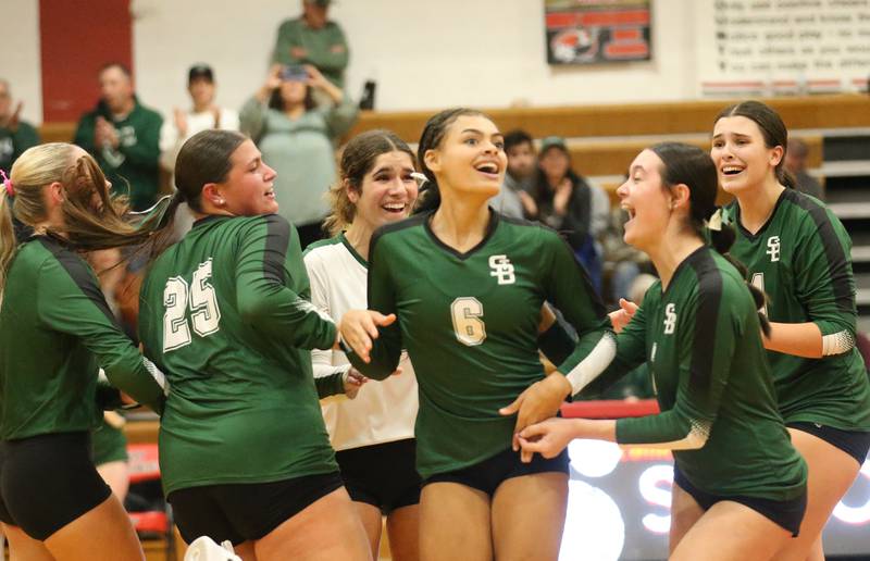 Members of the St. Bede volleyball team react after pulling off a upset over Henry-Senachwine on Tuesday, Oct. 21, 2025 at Henry-Senachwine High School.