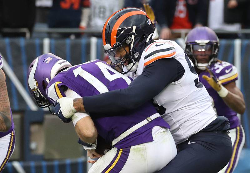 Chicago Bears defensive end Montez Sweat sacks Minnesota Vikings quarterback Sam Darnold in overtime Sunday, Nov. 24, 2024, at Soldier Field in Chicago.