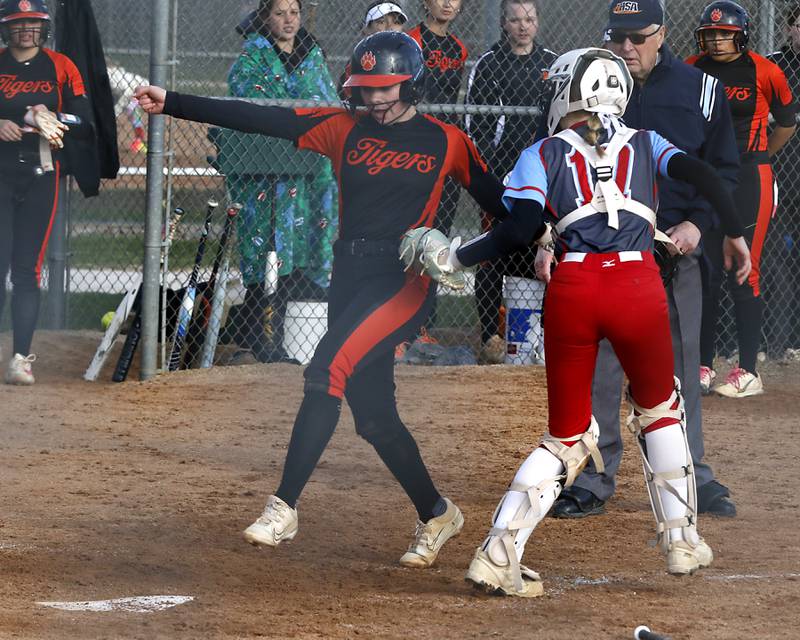 Marian Central's Bailey Keller tags out Crystal Lake Central's Kate Show as she tries to go home during a nonconference softball game on Thursday, April 3, 2025, at bates Park in Woodstock.