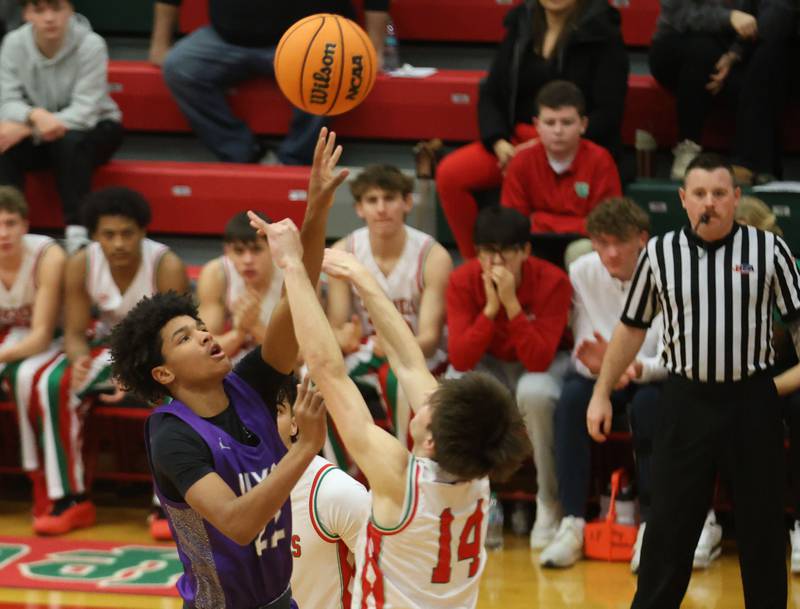 Dixon's Xavion Jones gets a shot off over L-P's Wyatt Kilday on Tuesday, Jan. 20, 2026 in Sellett Gymnasium at L-P High School.