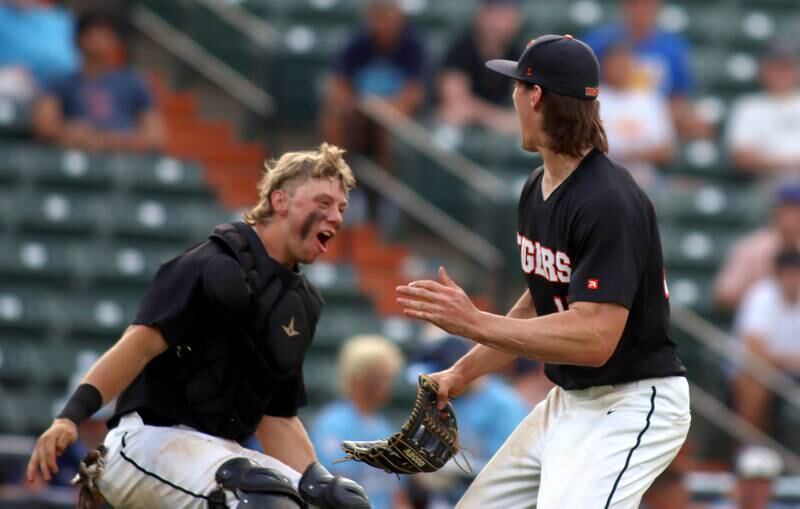 Crystal Lake Central’s Tigers begin to celebrate after the final out in supersectional baseball action against DePaul College Prep at Wintrust Field in Schaumburg Monday.