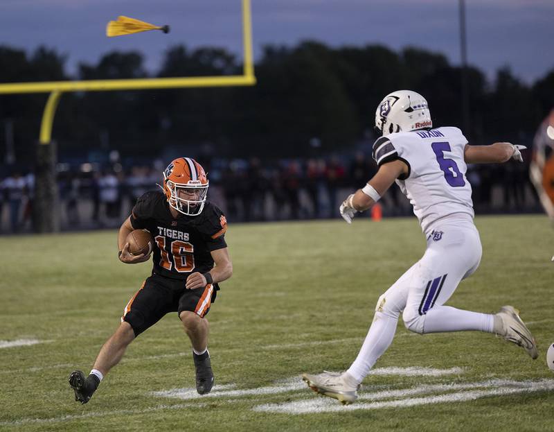 Dixon’s Logan Mershon closes in on Byron QB Andrew Talbert Friday, Sept. 5, 2025, at Byron High School.