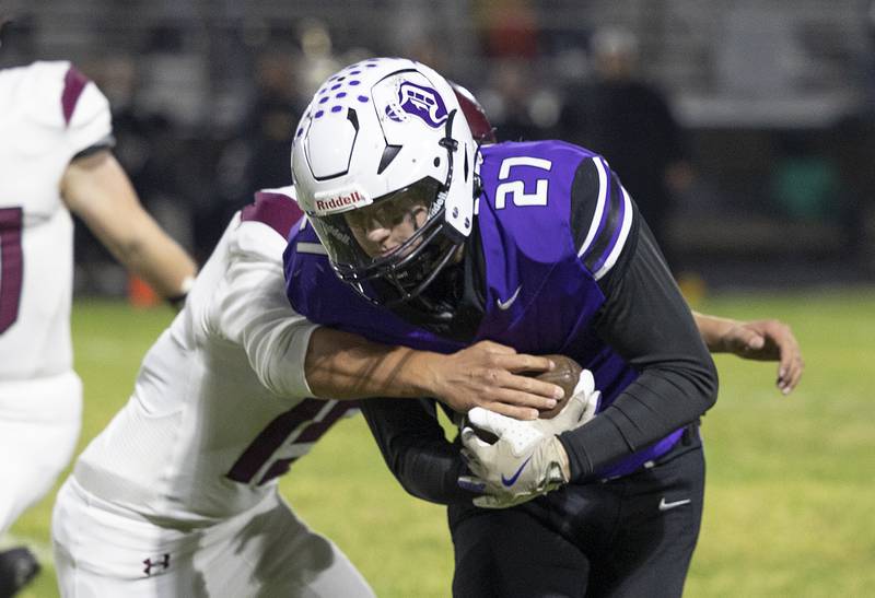 Dixon’s Eli Davidson fights for yards early in their game against Marengo Friday, Nov. 1, 2024 in the 4A football playoffs in Dixon.