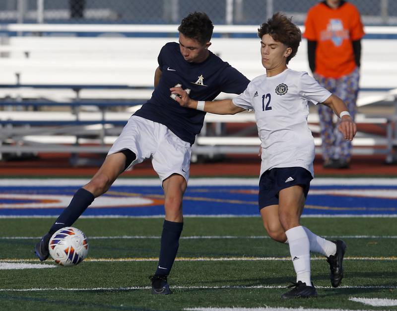 Belleville Althoff Catholic's Tyler Birdsong kicks the ball away from Lemont’s Billy Eliadis during an IHSA Class 3A state semifinal soccer match on Friday, Nov. 8, 2024, at Hoffman Estates High School.