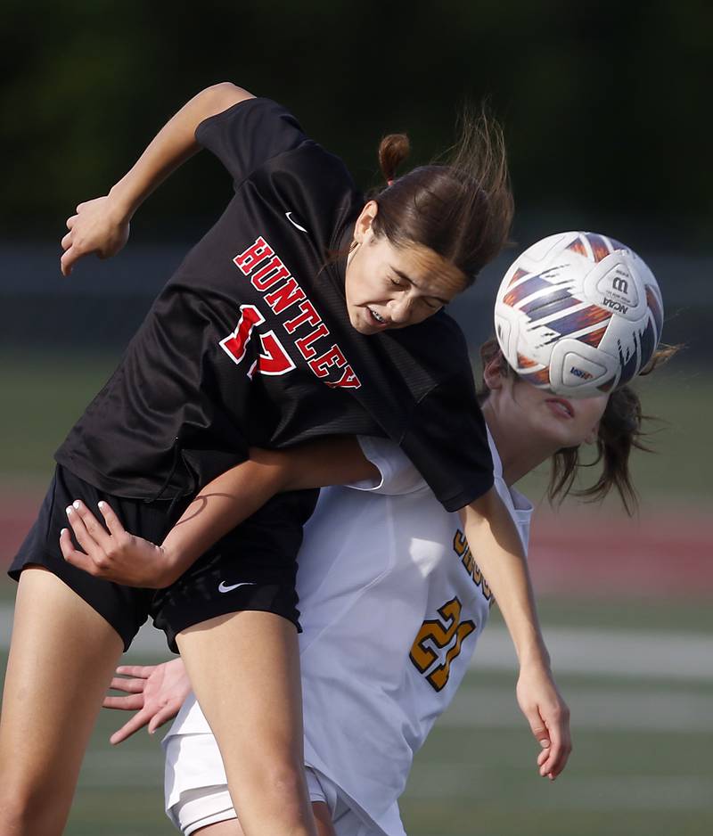 Huntley's Itzel Martinez goes over Jacobs' Kylie Deegan to head the ball during the IHSA Class 3A Huntley Girls Soccer Regional championship match on Friday, May 23, 2025, at Huntley High School.