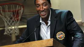 Scottie Pippen takes another kind of shot, to sign bottles of his bourbon Thursday at Richmond store
