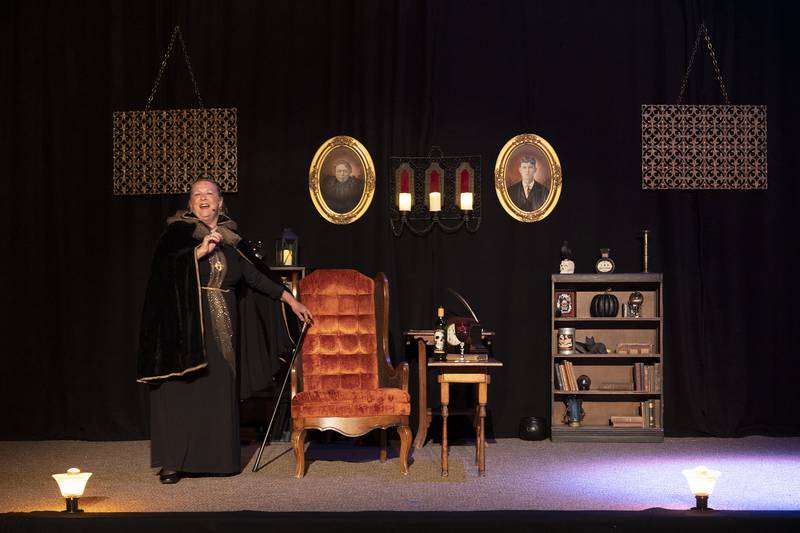 The Lady of the House Trudy Whalen, introduces the latest play, “Tapestry of Shadows,” performed by The Performing Arts Guild during rehearsal Tuesday, Oct. 7, 2025. The play centers on four stories written by Edgar Allen Poe and brought together in one play written PAG’s Morgan McConnell.