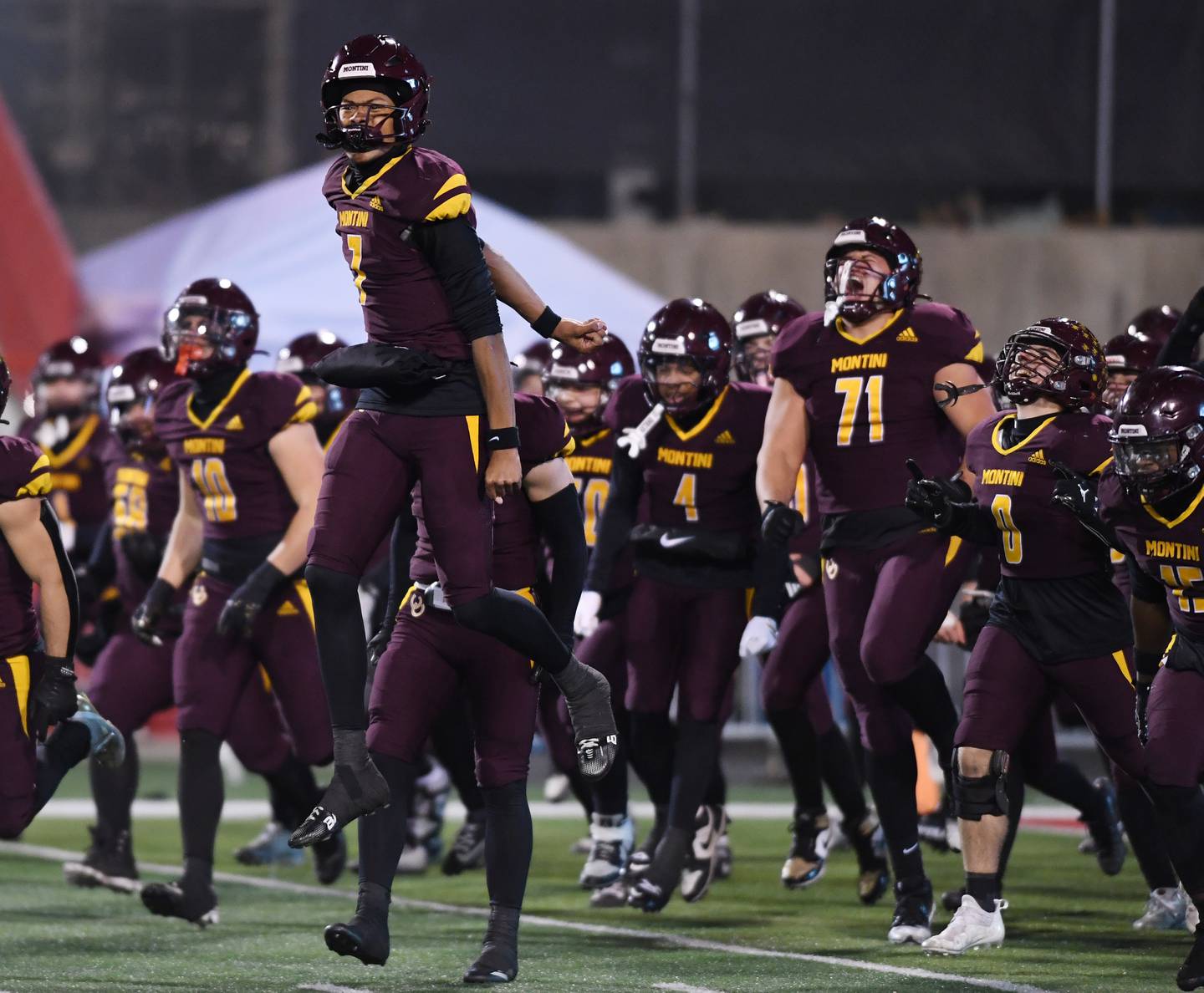 Montini quarterback Israel Abrams (7) gets fired up prior to the start of the IHSA Class 4A state championship game against Rochester on Friday, Nov. 28, 2025 in Normal.