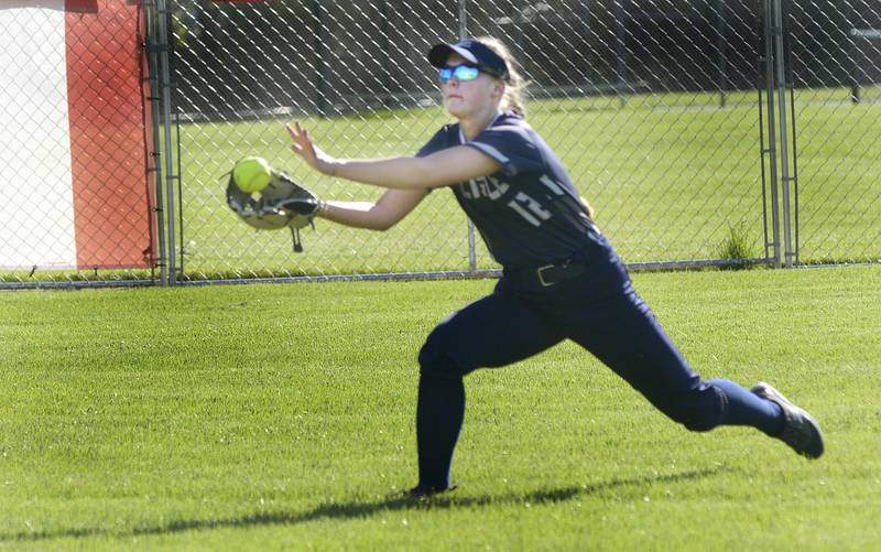 Lisle right fielder Emily Beniasz catches up with a sinking fly ball against Streator Tuesday at Streator.