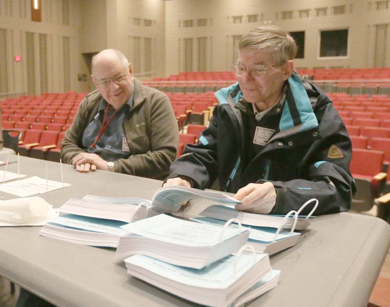 Election judges Victor Crosdale and Tom Kuffer look over chads on Tuesday, March 19, 2024 at Hall High School.