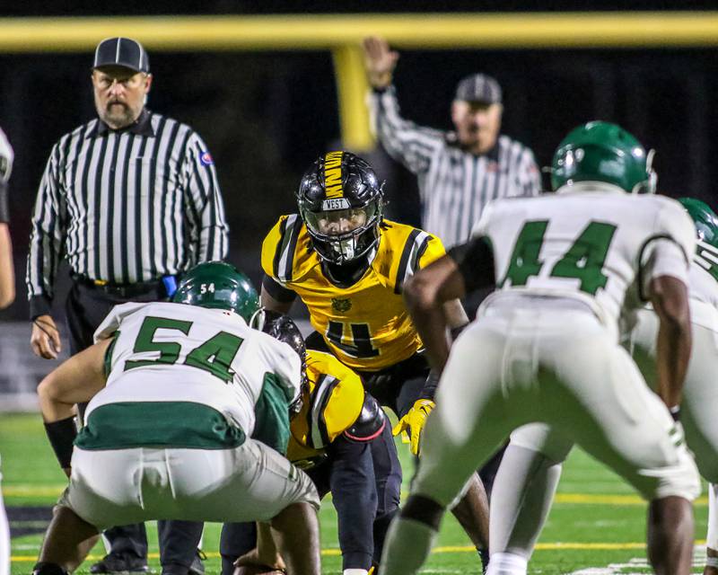 Joliet West's Micah Mcnair (4) looks into the backfield before the snap during a football game between Plainfield Central at Joliet West on Friday, Oct 25th, 2024  in Joliet.