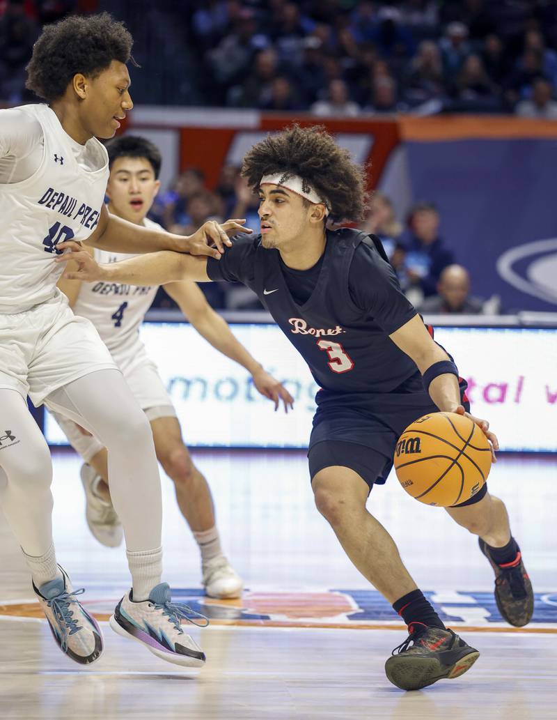 Benet's Jayden Wright (3) looks to get around DePaul College Prep's Blake Choice (10) during the IHSA Class 4A boys basketball state semifinal Friday, March 13, 2026 at the State Farm Center in Champaign.