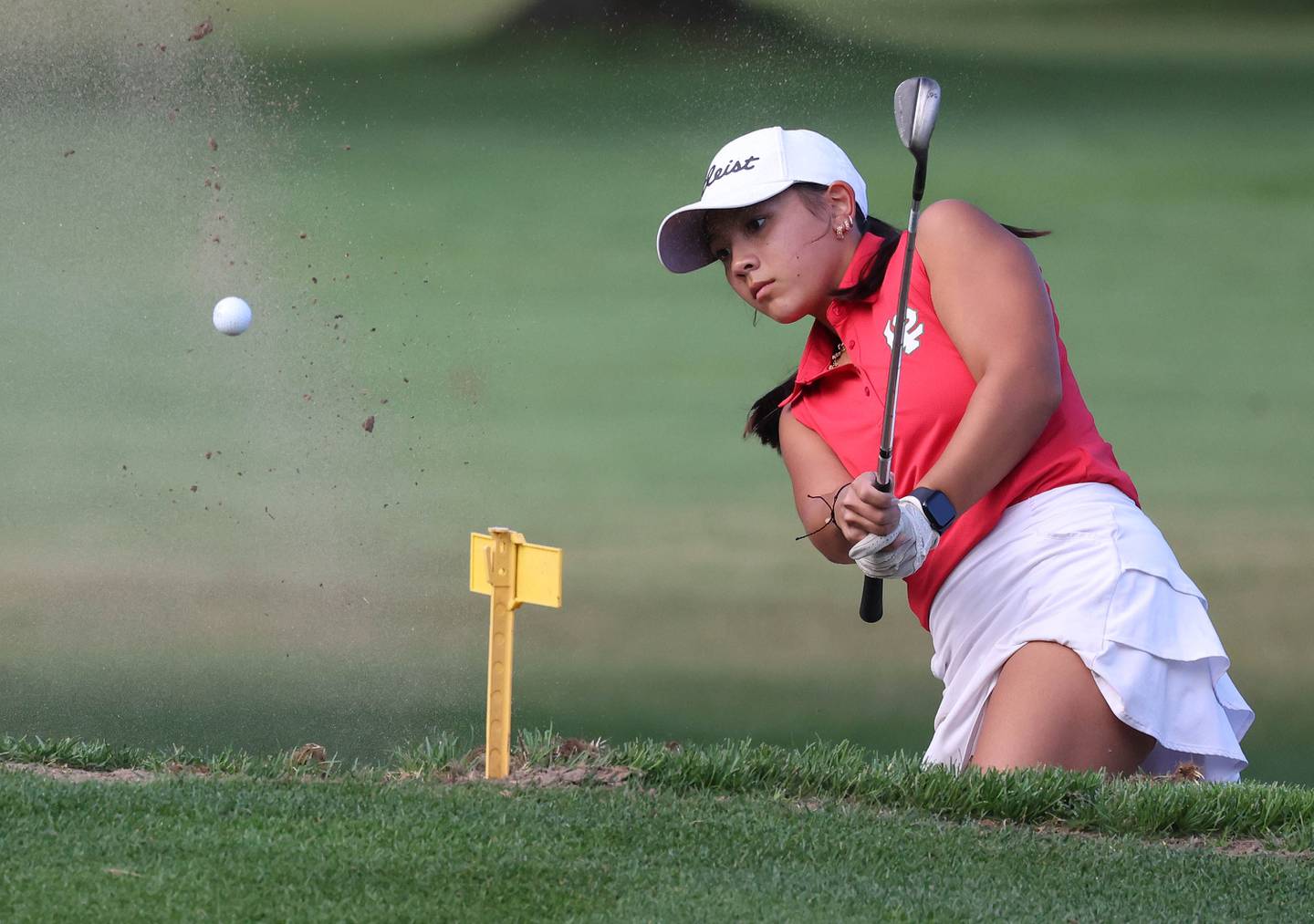 LaSalle-Peru’s Sophia Chiu blasts out of the bunker on the second hole Tuesday, Sept. 23, 2025, during the Interstate 8 girls golf meet at the Sycamore Golf Club.