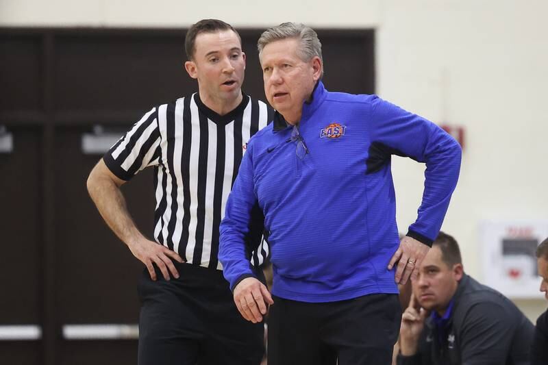 Lincoln-Way East head coach Rich Kolimas talks with the referee during the game against Bolingbrook on Tuesday, Dec.12th, 2023 in Frankfort.