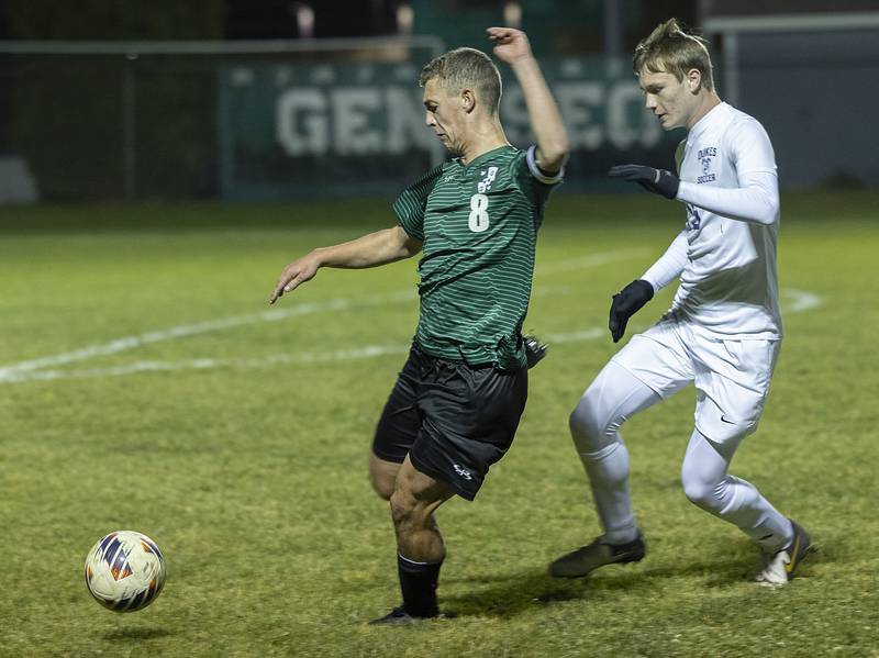 Dixon’s Logan Grett and Geneseo’s Eric States go after a ball Wednesday, Oct. 23, 2024, during the class 2A soccer regional in Geneseo.