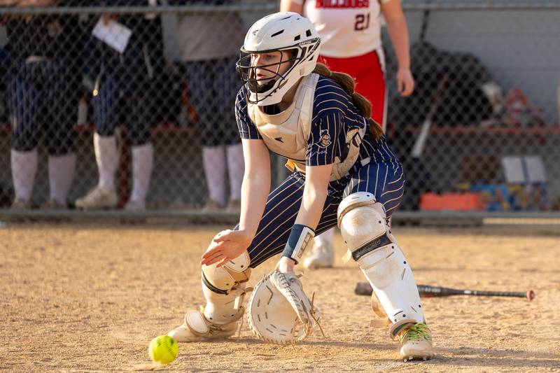 Marquette’s Catcher grounds ball infront of home plate on Wednesday, April 16, 2025 at Streator High School in Streator.