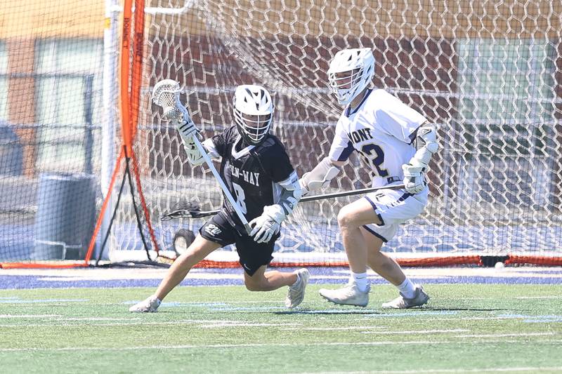 Lincoln-Way’s Matt Gade rolls out to pass against Lemont on Saturday, April 25, 2026 in Lemont.