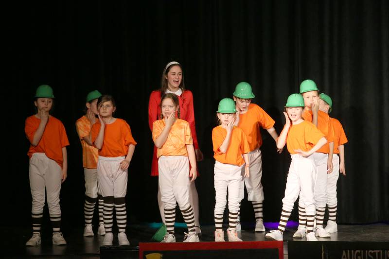 Veruca Salt, played by Maddy Wasilewski, (back middle) acts out a scene with the Oompa Loompa's during a performance of Willy Wonka on Thursday, March 16, 2023 at Putnam County High School.