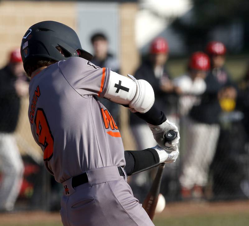 McHenry’s Carver Cohn hits a grand slam home run during a Fox Valley Conference baseball game against Huntley on Friday, April 11, 2025, at Huntley High School.