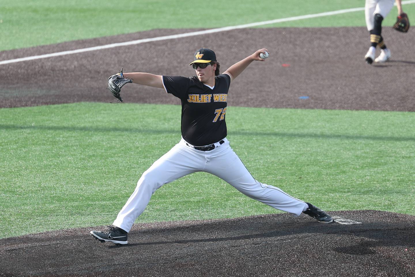 Joliet West’s Conner Hogan delivers a pitch against Joliet Central on Thursday, May 11, 2023 in Joliet.
