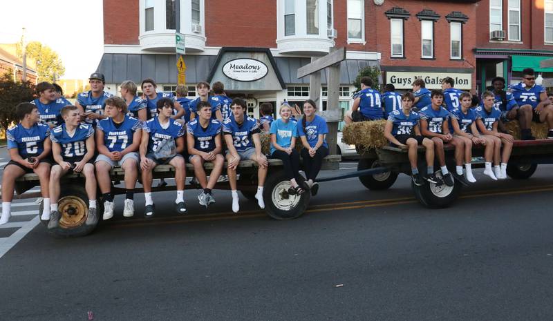 The Princeton High School football team rides during the homecoming parade on Thursday, Sept. 25, 2025 along South Main Street in Princeton .