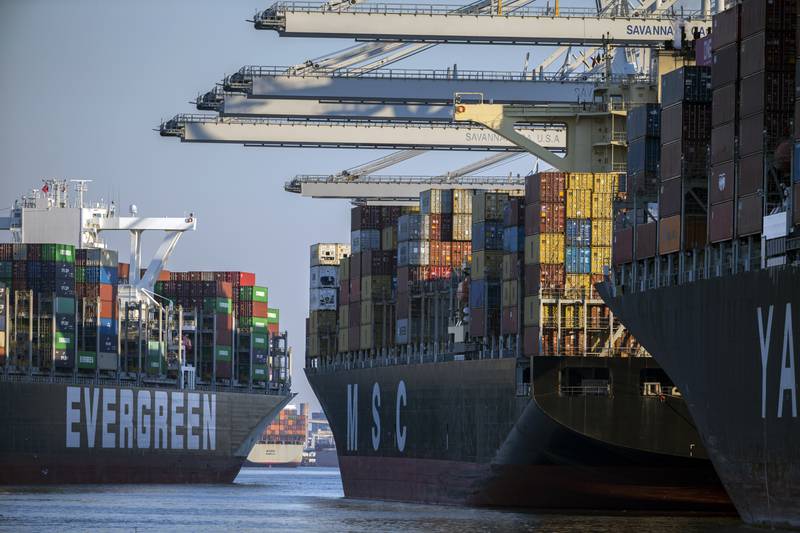 Container ship Ever Far, left, sails down river past the Georgia Ports Authority's Port of Savannah, Wednesday, Sept. 29, 2021, in Savannah, Ga. Inflation has spiked during the recovery from the pandemic recession as Americans have ramped up spending on such items as cars, furniture and appliances. Those increased purchases have clogged ports and warehouses and exacerbated supply shortages of semiconductors and other parts. (AP Photo/Stephen B. Morton)