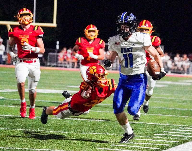 Lincoln-Way East's Ryan Usher (11) runs after the catch against Batavia during a football game at Batavia High School on Friday, Sep 1, 2023.