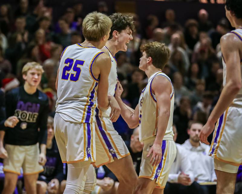 Downers Grove North's Jake Riemer (1) celebrates being fouled with teammates during basketball game between Downers Grove South at Downers Grove North. Dec 16, 2023.