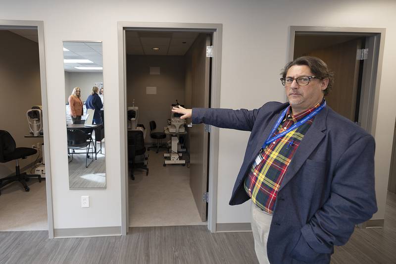 Dr. Darrin Vits gestures to the Whiteside County Health Department’s new Optometry pre-test rooms during an open house Saturday, Nov. 2, 2024.