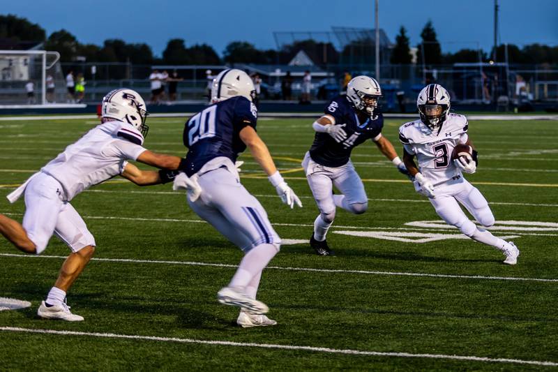 Plainfield North's Darin Ashiru runs downfield against Plainfield South on Sept. 13, 2024.