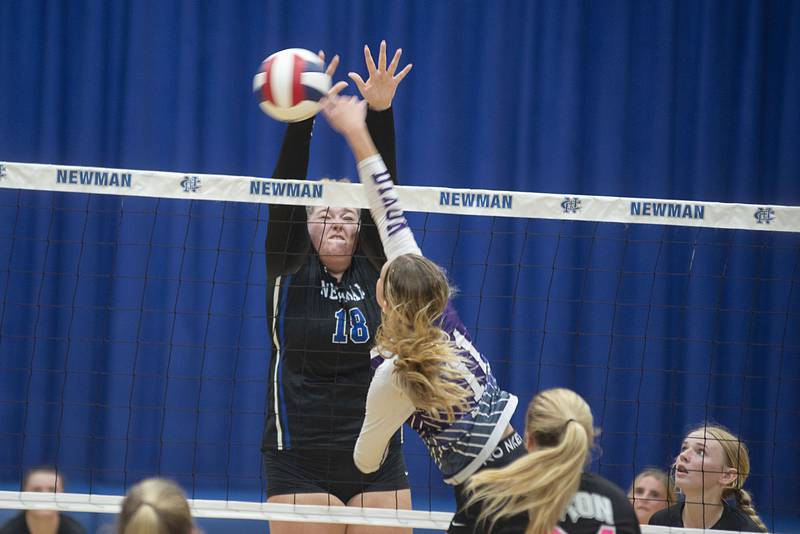 Newman’s Kennedy Rowzee goes up to block a shot by Dixon’s Ella Govig Monday, Aug. 29, 2022.