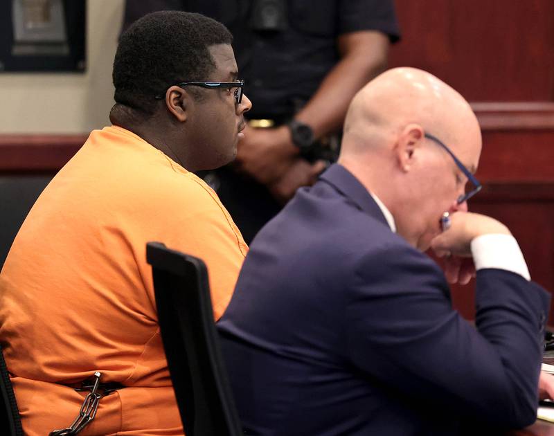 Timothy Doll, who pleaded guilty to murdering DeKalb High School freshman Gracie Sasso-Cleveland in 2023, and his attorney Andrew Nickel, listen to testimony Thursday, Aug. 14, 2025, during his sentencing hearing at the DeKalb County Courthouse in Sycamore. Doll was sentenced to 52 years in prison.