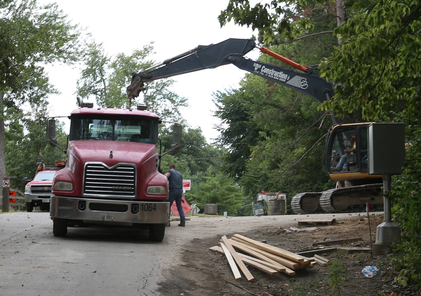 A crew with D Construction loads materials onto a flat bed truck while working on Tuesday, Sept. 5, 2023 at Matthiessen State Park. This project will reconstruct a retaining wall along the park’s entrance road. Other improvements include new pavement, gutters and guardrails. Following the closures, traffic will be reduced to one lane and will be controlled by signals during the project, which is expected to be completed by Nov. 30.