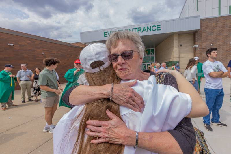 Laurie Pfeifer congratulates Madison Degrush outside after the Seneca High School Class of 2026 Graduation on May 17, 2026 at Seneca High School.