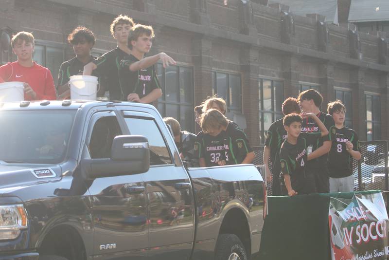 The L-P boys soccer team rides on a float during the homecoming game on Thursday, Oct. 2, 2025 downtown Peru.