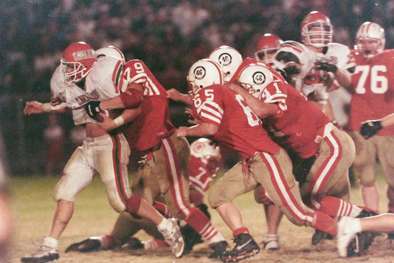 Ottawa's Craig Renz (79) and several other Pirates stop a La Salle-Peru ball carrier on Friday, Oct. 23, 1992 at King Field in Ottawa.