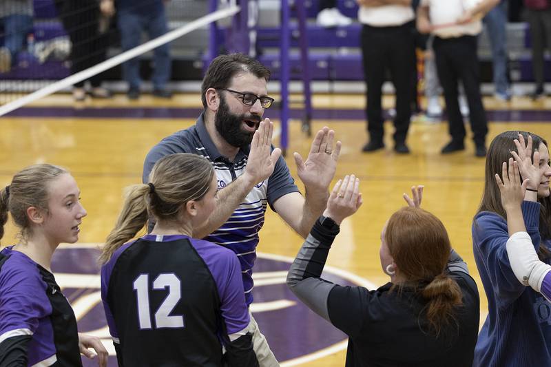 Dixon coach Bunyan Cocar celebrates with his team after winning the regional over Morris Thursday, Oct. 31, 2024 in the class 3A regional championship at Dixon High School.