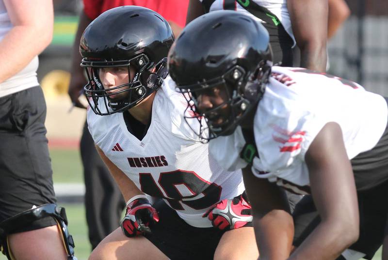 Northern Illinois Huskies running back Brock Lampe (left) lines up for a play during the first practice of the season Wednesday, Aug. 2, 2023, at Huskie Stadium in DeKalb.
