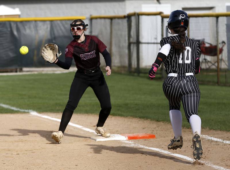 Prairie Ridge's Mary-Kate Center fields the ball to get Crystal Lake Central's Elise Thorsen out at first base during a Fox Valley Conference  softball game on Monday, April 20, 2026, at Prairie Ridge High School.
