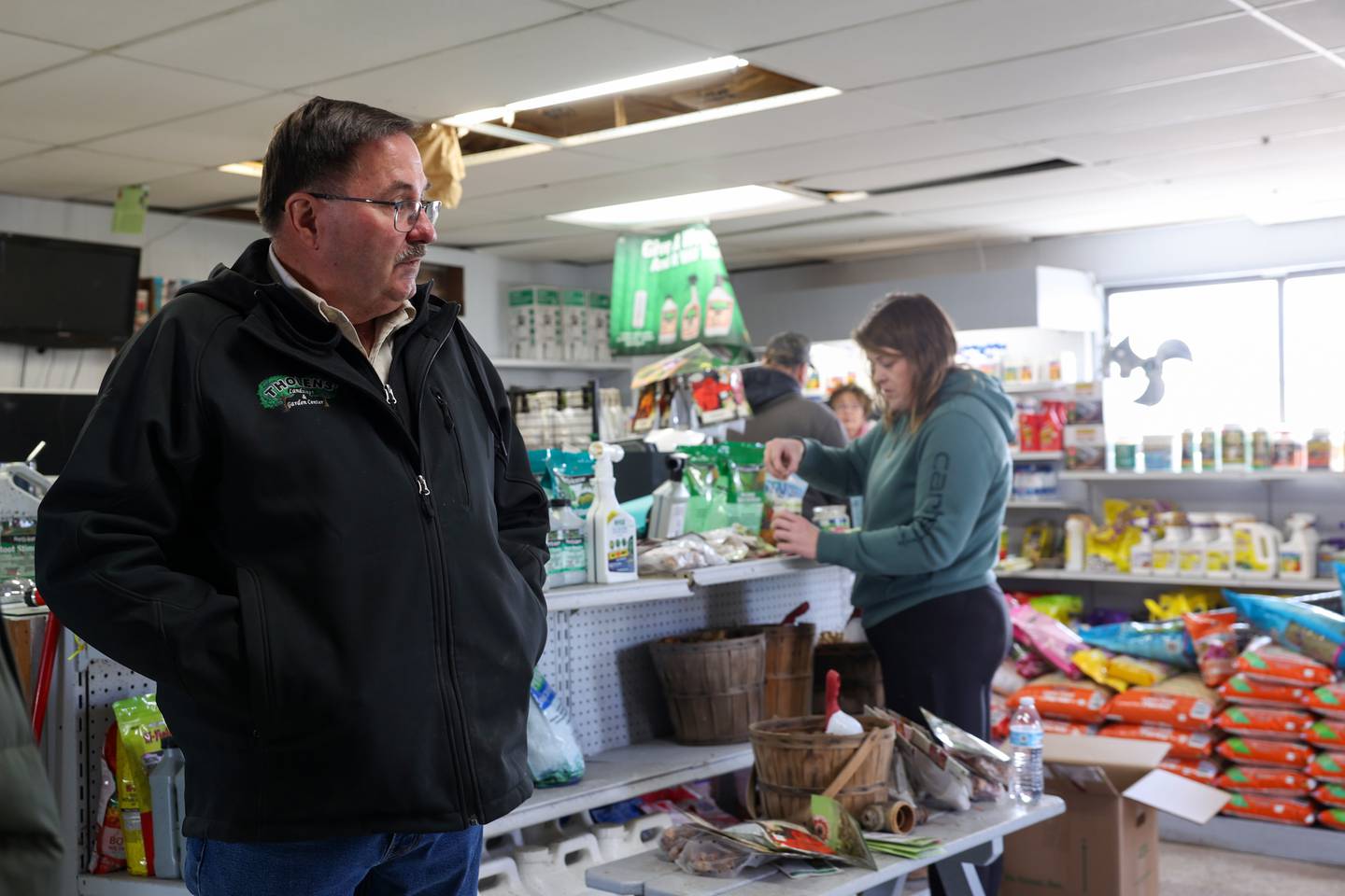 Steve Tholen looks around at Tholens' Landscape & Garden Center along South Schuyler Avenue in Kankakee as employees help to clean up the store on March 13, 2026, following the March 10 tornado that caused widespread destruction in Kankakee County.